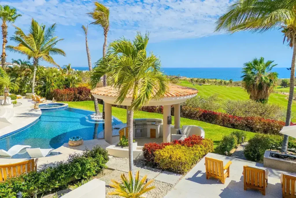 Pool, palapa, and ocean at Casa Kokomo